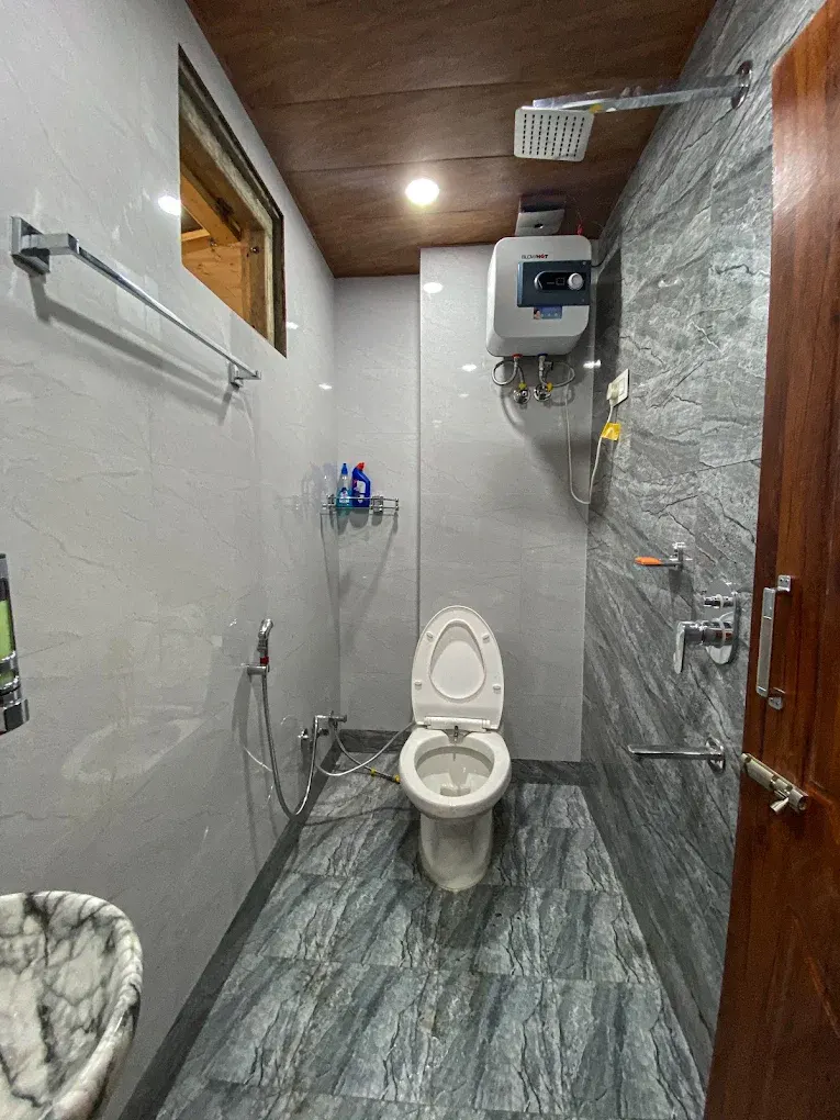 Clean attached bathroom at Alpine Crest Homestay